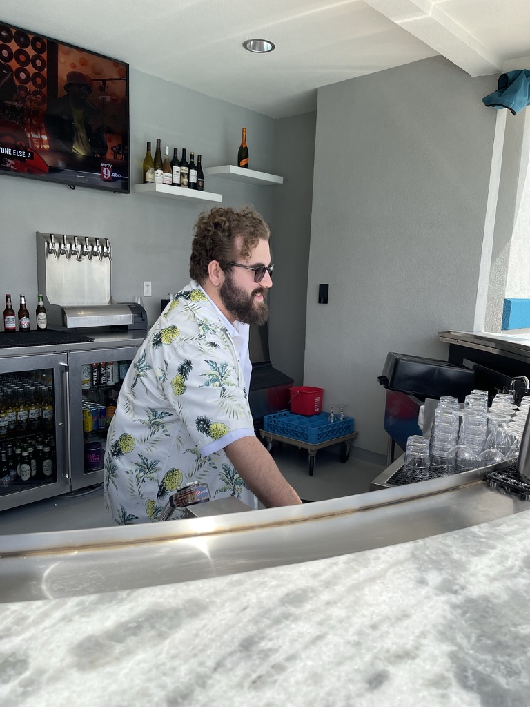 Kurt at the Courtyard pool bar in tropical pineapple shirt